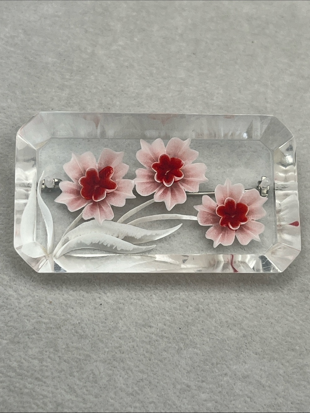 Vintage carved lucite red and white floral brooch approximately 2.3 x 1.3 inches